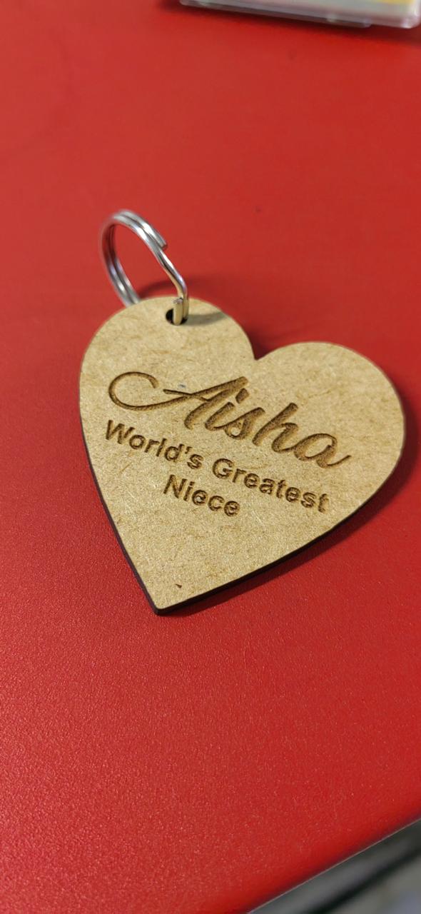 Heart-shaped wooden keyring with a laser-engraved name